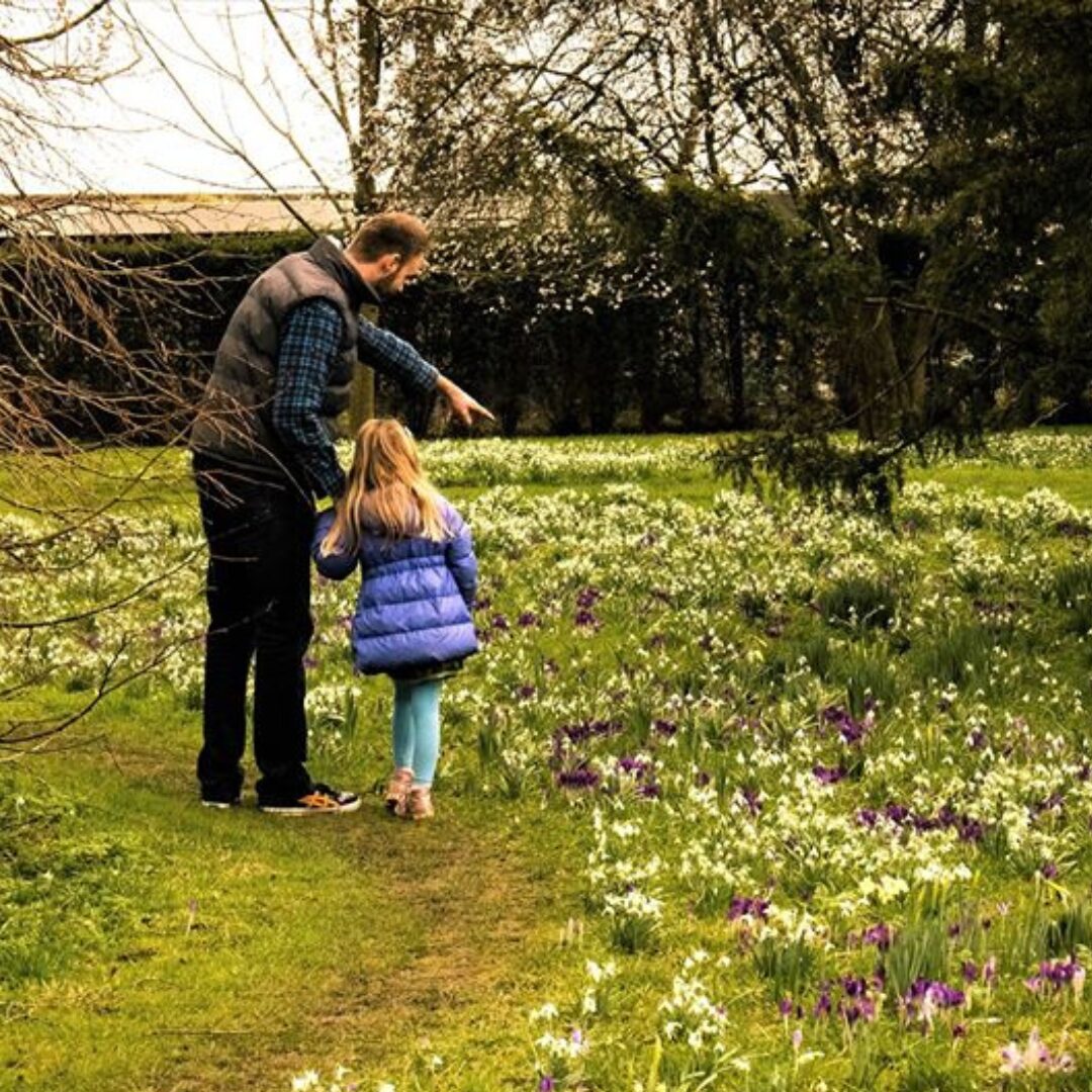 An image of a family enjoying their visit to Snowdrop Month at The Bishop's Palace