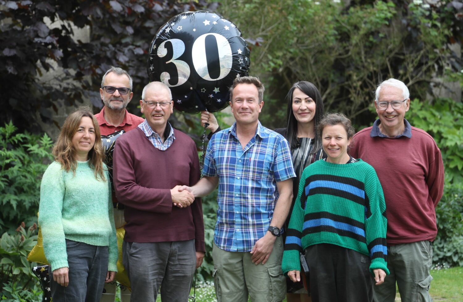 Image of retiring gardener Rob Hole with team members at The Bishop's Palace