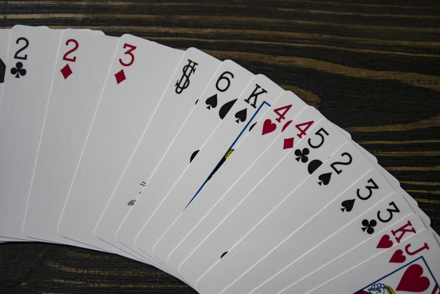 Playing cards on a brown table