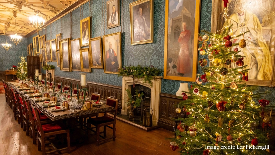 An image of the Christmas decorations in the Long Gallery of The Bishop's Palace in Wells, Somerset.