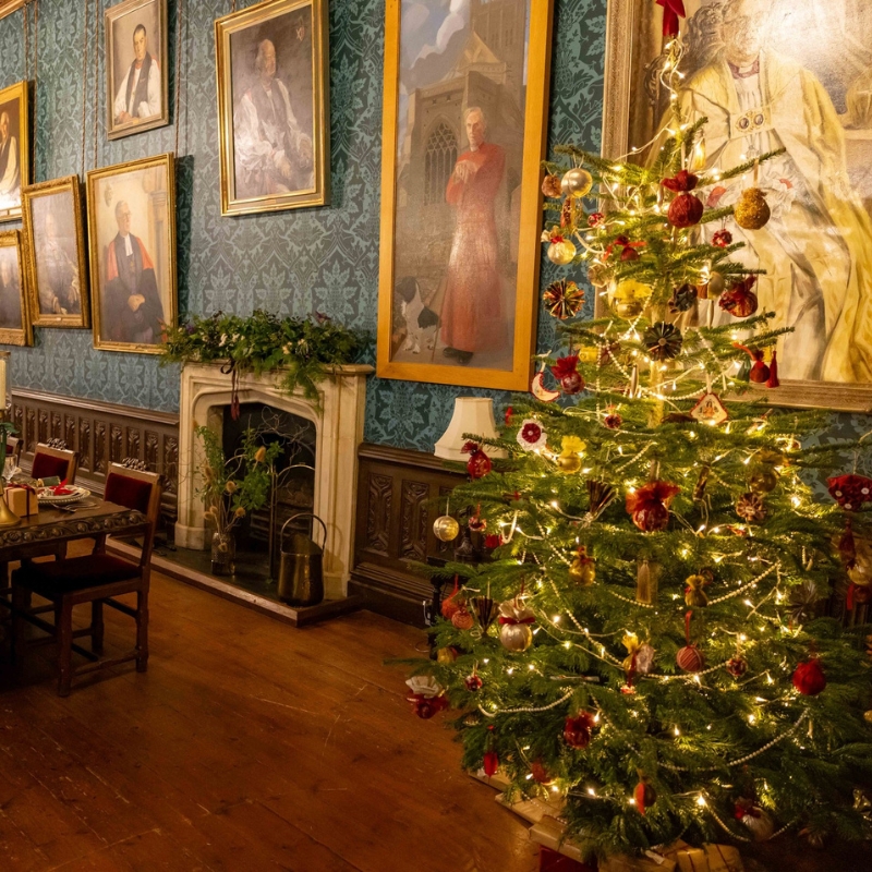 An image of the Long Gallery, decorated for Christmas