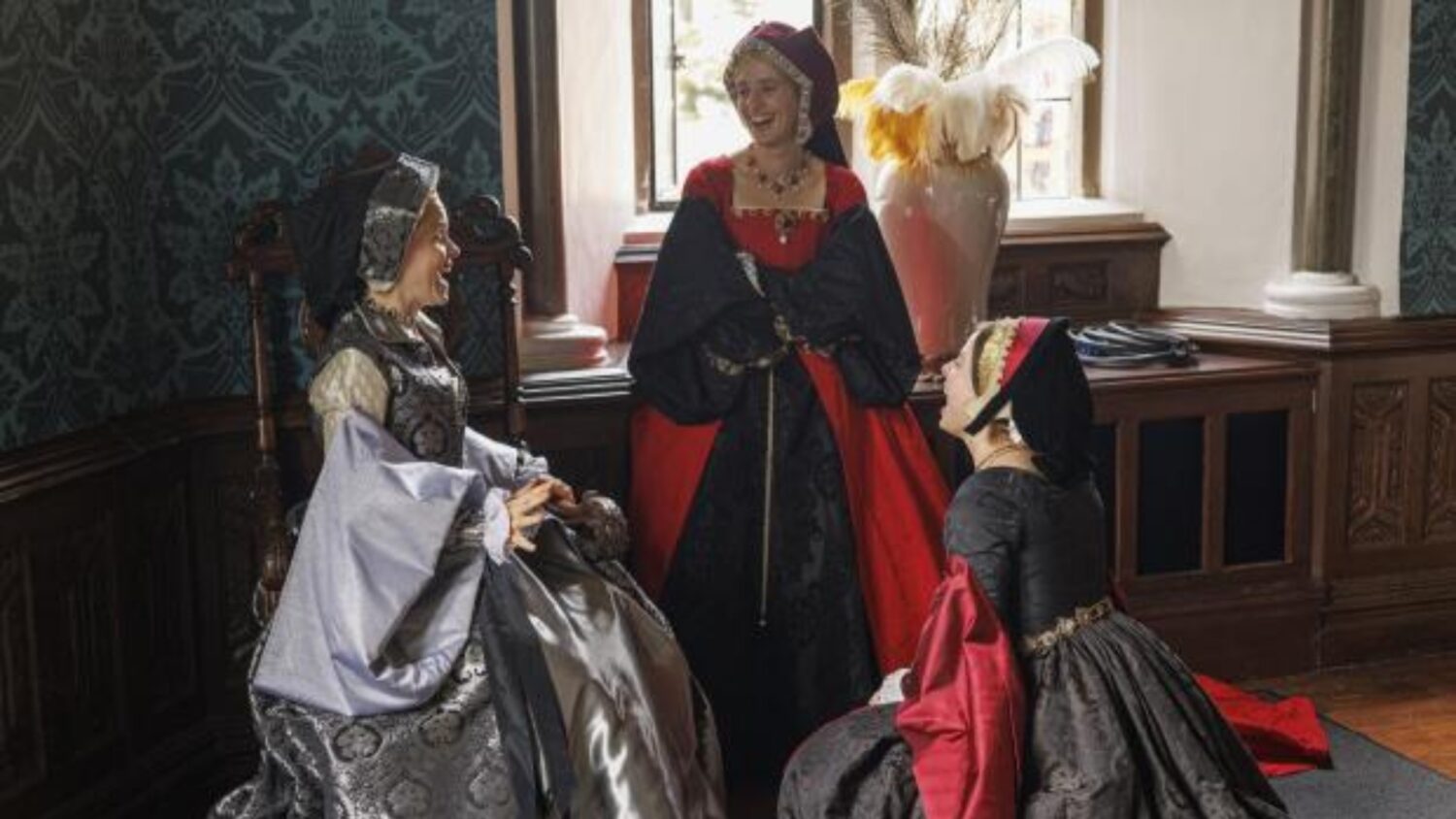 An image of the cast of Wolf Hall: The Mirror and the Light in the Long Gallery of The Bishop's Palace in Wells, Somerset.