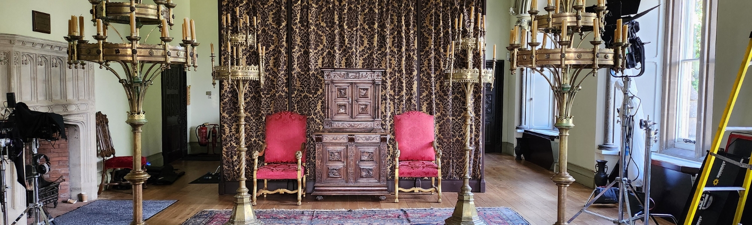 An image of The Bishop's Palace dressed as a filming location in Wells, Somerset.