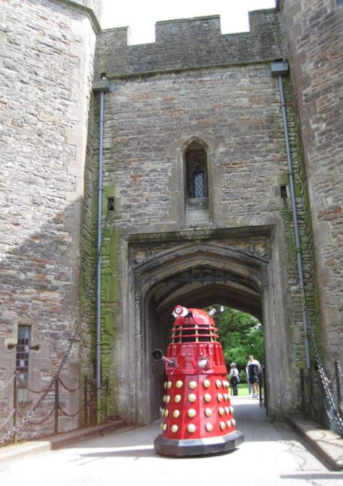 An image of a red dalek in front of the Gatehouse at The Bishop's Palace.