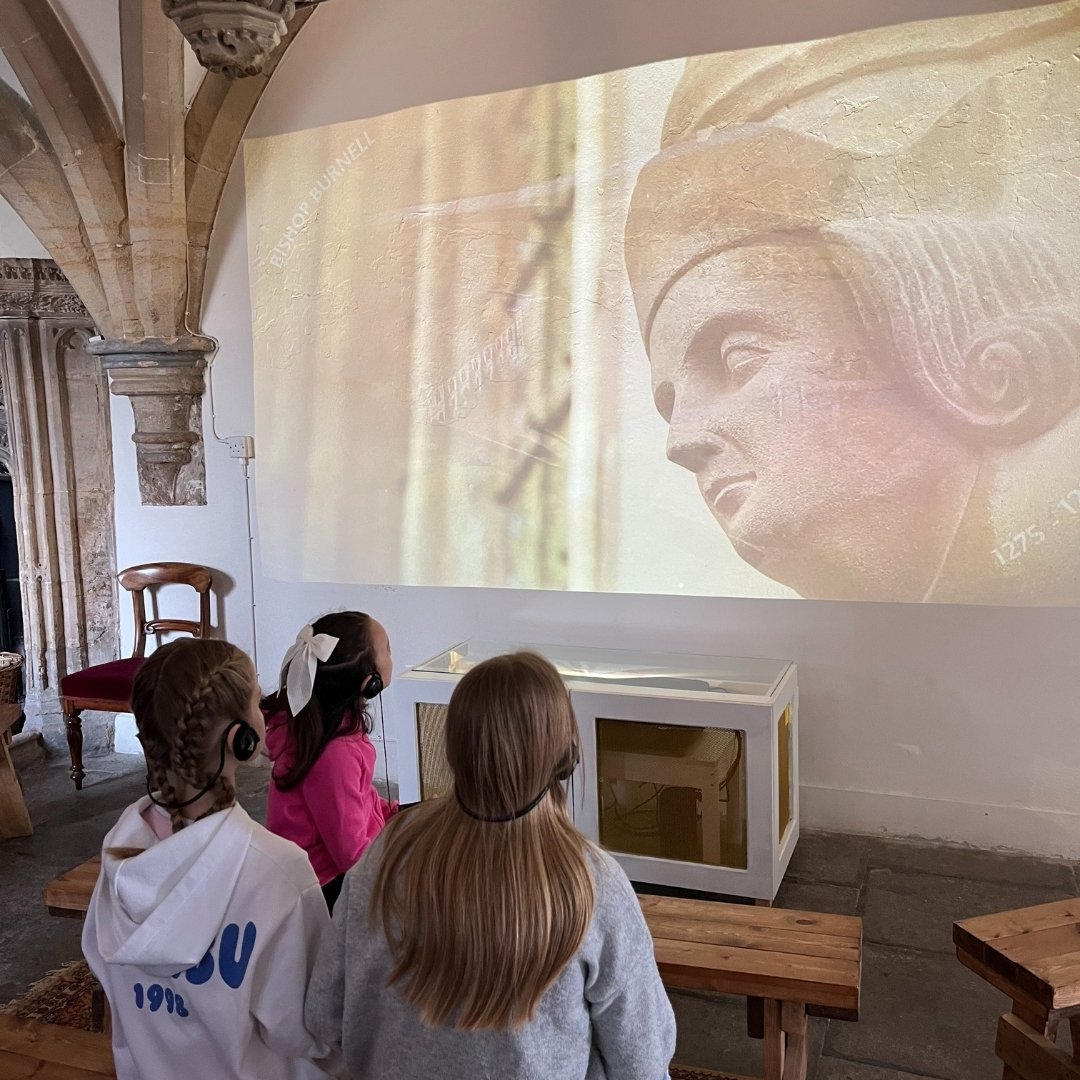 An image of a family enjoying the multimedia tour at The Bishop's Palace