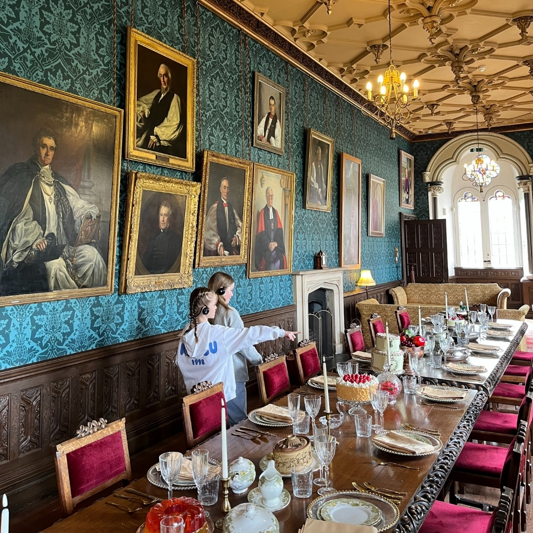 An image of a family enjoying the multimedia tour at The Bishop's Palace