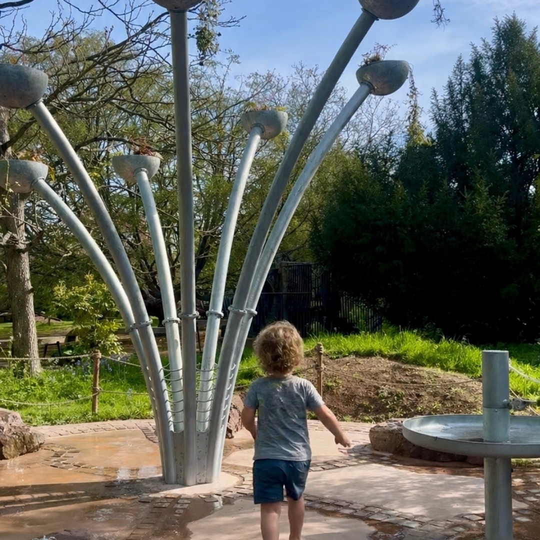 An image of a family enjoying the Splash Play Zone at The Bishop's Palace.