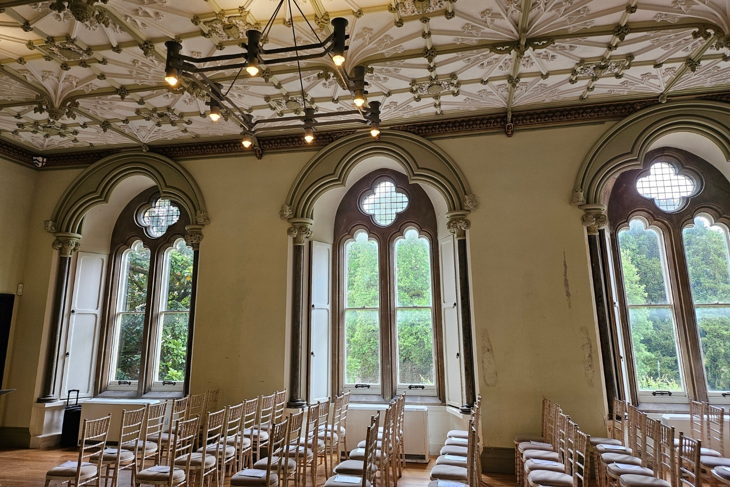 An image of the Conference Room at The Bishop's Palace decorated for a ceremony.