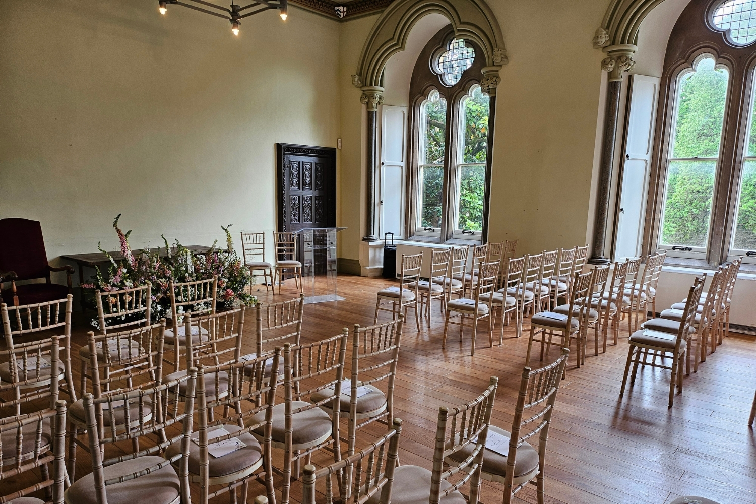 An image of the Conference Room at The Bishop's Palace decorated for a ceremony.