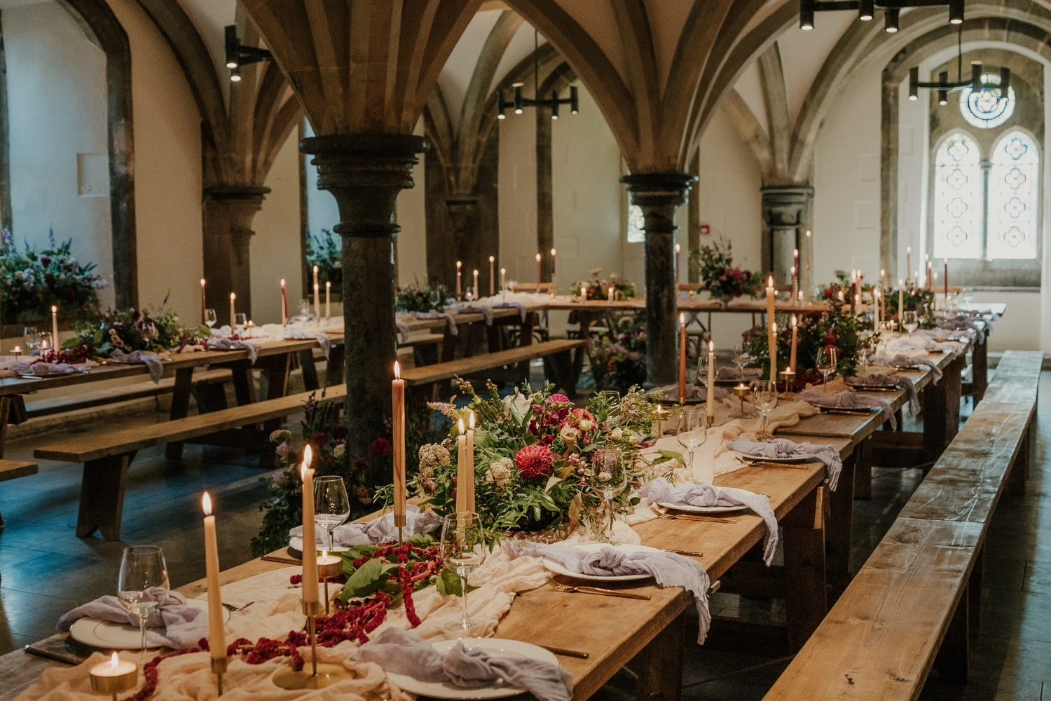 An image of the vaulted Undercroft set up for a wedding reception.